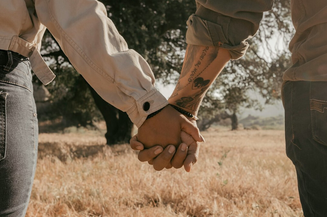 Two business partners shaking hands after a media partnership meeting